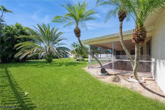 view of yard featuring a sunroom