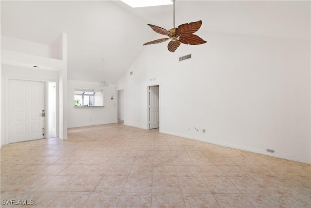 unfurnished living room with visible vents, high vaulted ceiling, a ceiling fan, light tile patterned floors, and baseboards