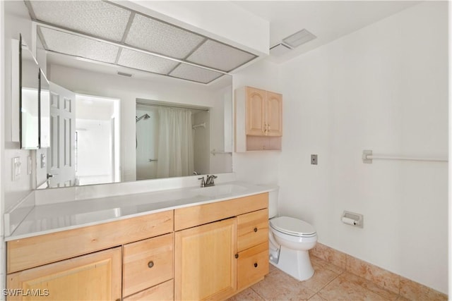 full bath with vanity, tile patterned floors, toilet, and a shower