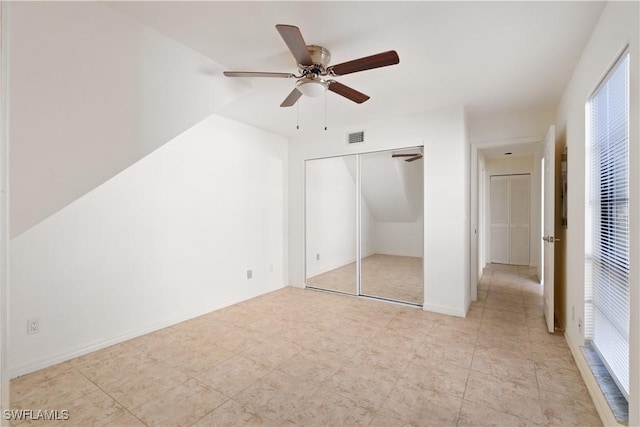 unfurnished bedroom featuring visible vents, baseboards, a closet, and a ceiling fan