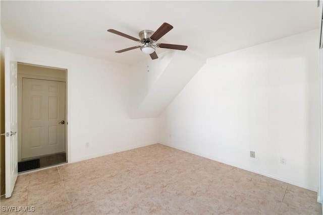 additional living space featuring baseboards and ceiling fan