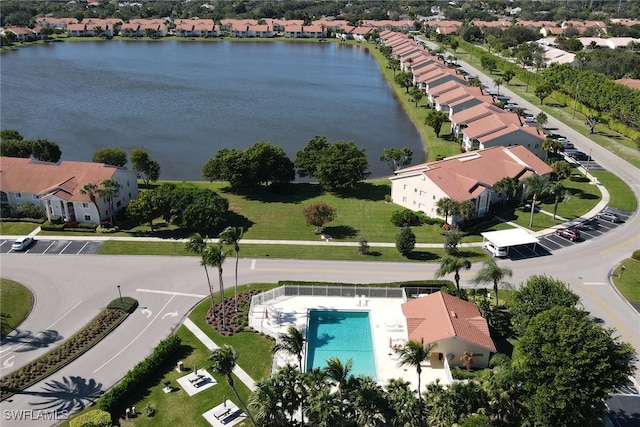 birds eye view of property with a residential view and a water view