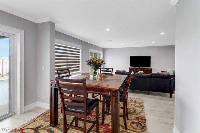 dining space featuring recessed lighting, baseboards, marble finish floor, and crown molding