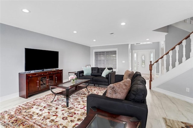 living area featuring recessed lighting, baseboards, and stairs