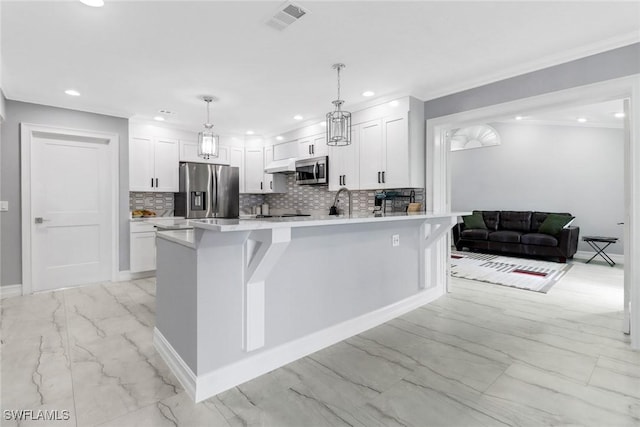 kitchen featuring marble finish floor, white cabinetry, stainless steel appliances, and light countertops