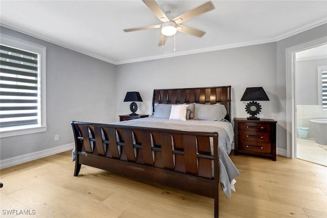 bedroom featuring a ceiling fan, baseboards, ornamental molding, light wood-style floors, and connected bathroom