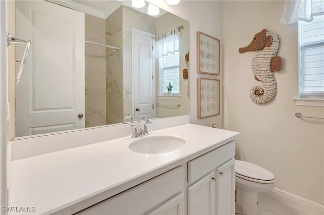 bathroom featuring baseboards, toilet, marble finish floor, vanity, and a shower