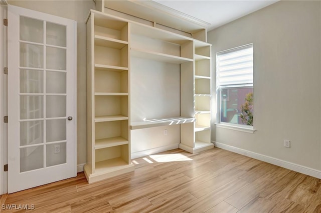 spacious closet with wood finished floors