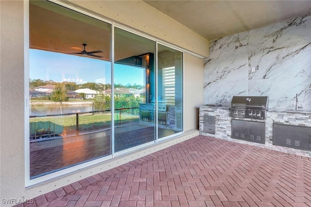 view of patio with a grill and exterior kitchen