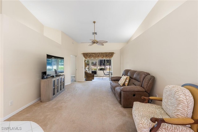 living area featuring baseboards, light carpet, high vaulted ceiling, and a ceiling fan