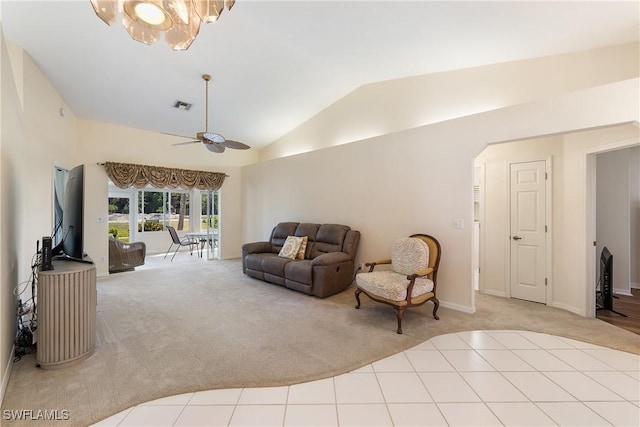 living area featuring lofted ceiling, ceiling fan with notable chandelier, visible vents, and carpet floors