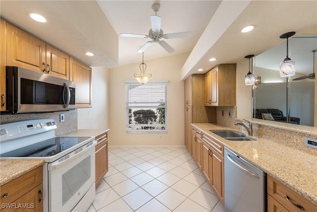 kitchen with tasteful backsplash, decorative light fixtures, stainless steel appliances, and a sink