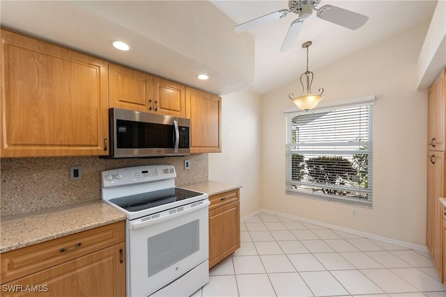 kitchen featuring white electric stove, lofted ceiling, stainless steel microwave, decorative light fixtures, and tasteful backsplash