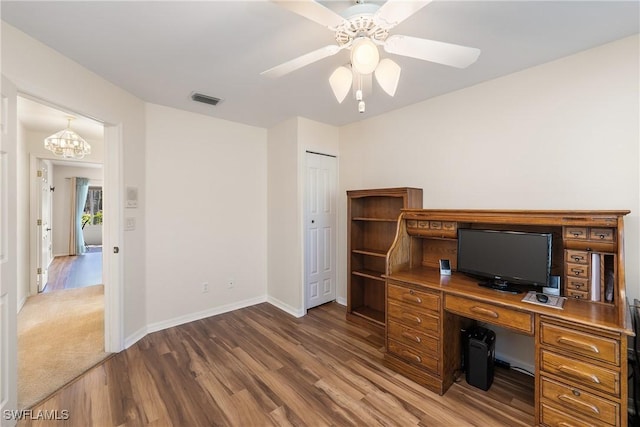 office area with visible vents, baseboards, wood finished floors, and a ceiling fan