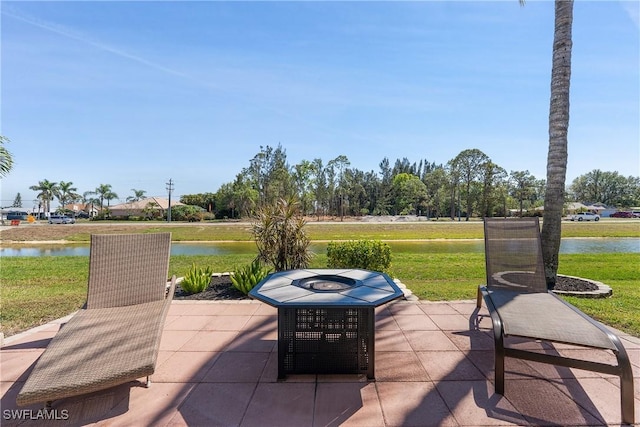 view of patio with a water view