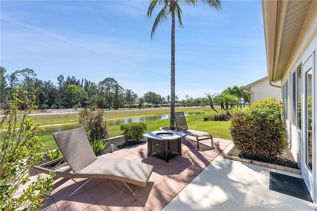 view of patio featuring a water view