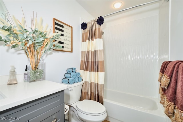 bathroom featuring vanity, shower / tub combo, and toilet