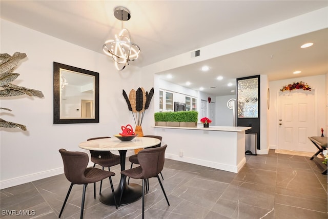 dining space featuring a notable chandelier, visible vents, recessed lighting, and baseboards