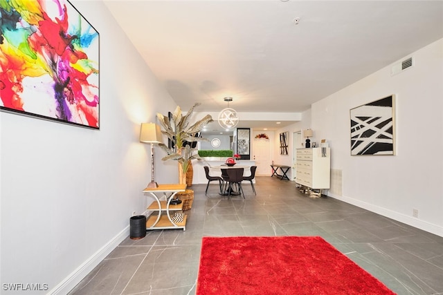 tiled dining area with visible vents and baseboards