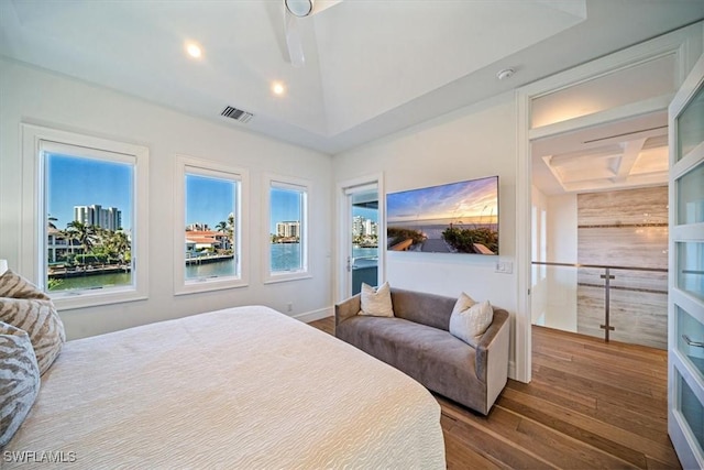 bedroom featuring recessed lighting, wood finished floors, and visible vents