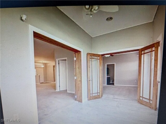 hallway with carpet floors