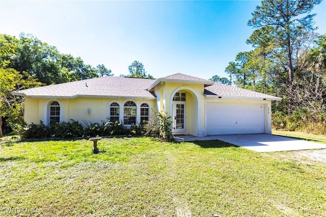 view of front facade with stucco siding, an attached garage, driveway, and a front lawn