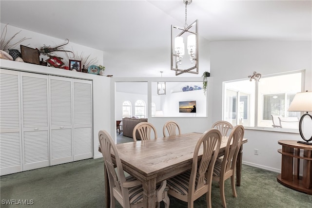 dining space with carpet floors and vaulted ceiling