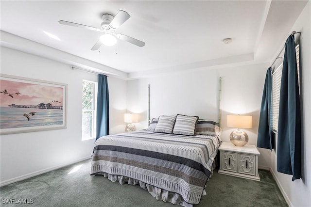 carpeted bedroom with baseboards and ceiling fan