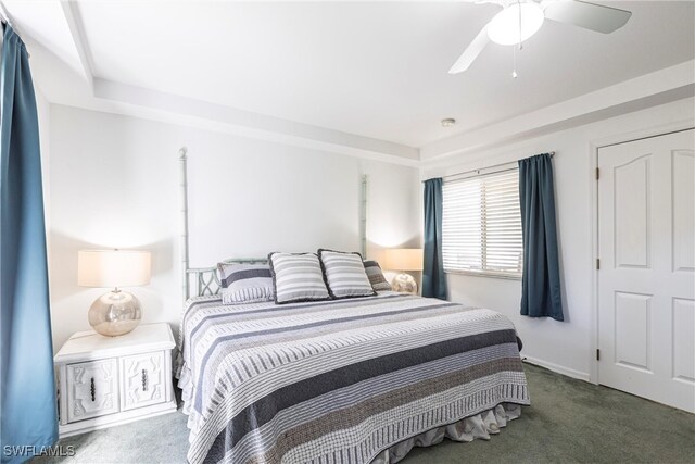 carpeted bedroom with a ceiling fan