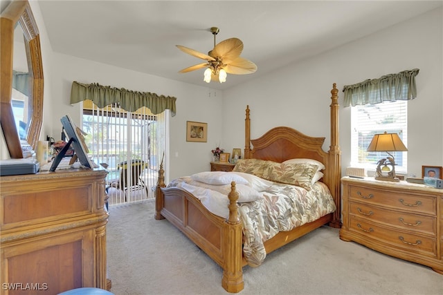 bedroom with access to exterior, light colored carpet, and ceiling fan