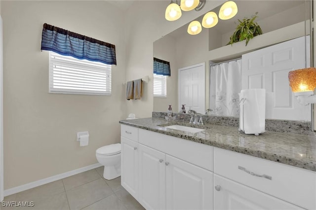 full bathroom featuring baseboards, plenty of natural light, toilet, and tile patterned flooring