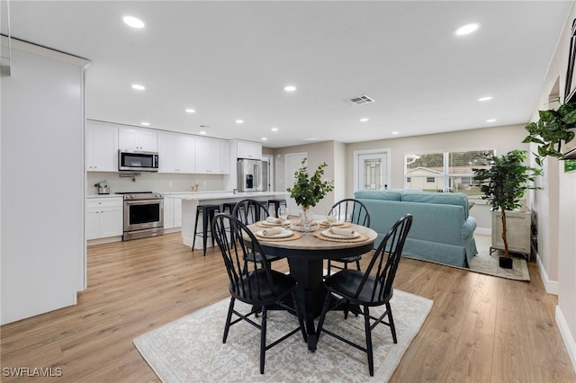 dining area with visible vents, recessed lighting, baseboards, and light wood-style floors