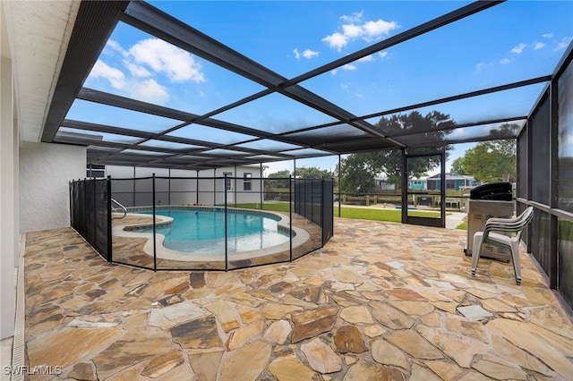 pool with a lanai and a patio