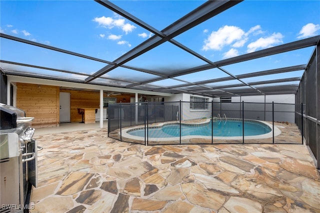 view of swimming pool with a fenced in pool, a lanai, and a patio area