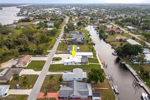 bird's eye view featuring a residential view and a water view