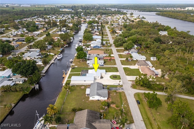 birds eye view of property featuring a residential view and a water view