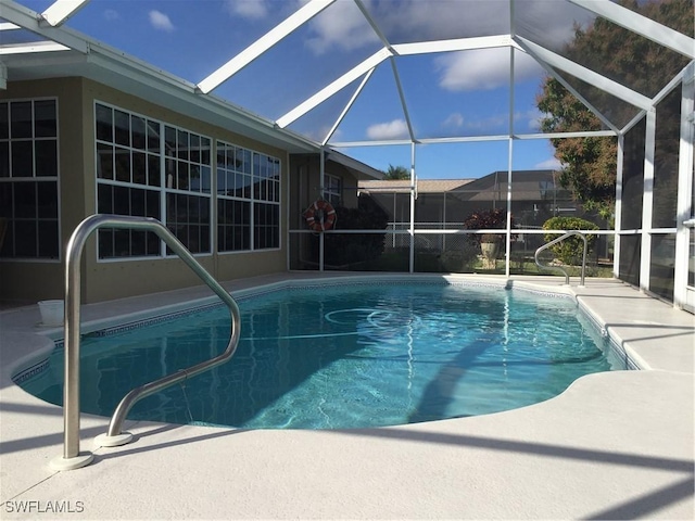 outdoor pool featuring a patio and a lanai