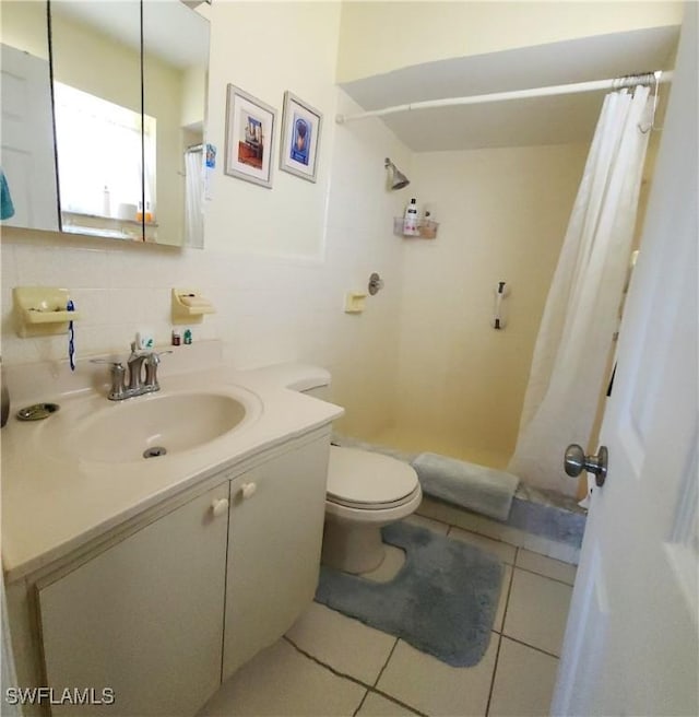 full bathroom featuring tile patterned floors, toilet, tasteful backsplash, a shower with shower curtain, and vanity