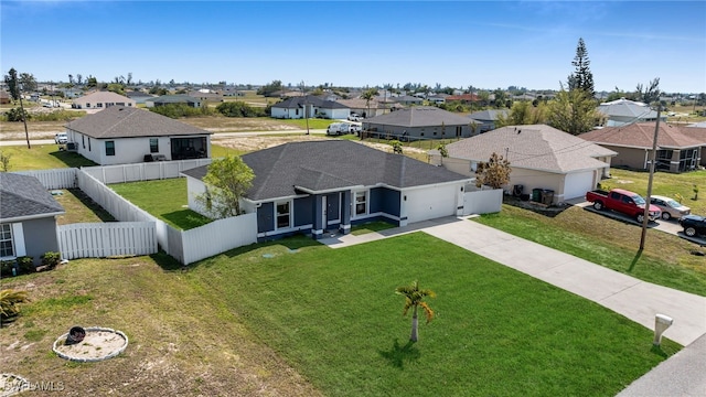 birds eye view of property with a residential view