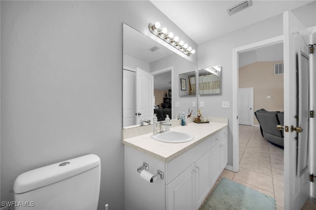 bathroom with vanity, tile patterned floors, toilet, and visible vents