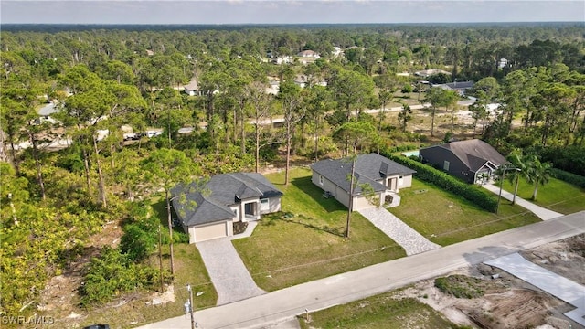 drone / aerial view featuring a view of trees