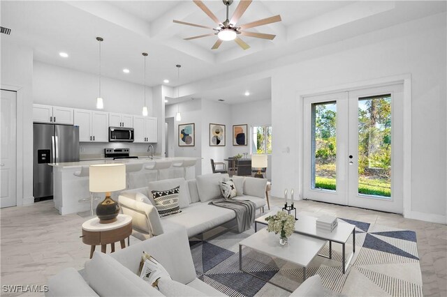 living area featuring marble finish floor, coffered ceiling, a high ceiling, and french doors