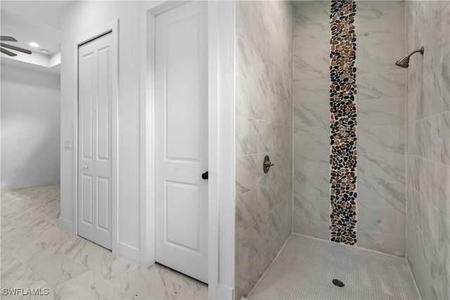 bathroom with a tile shower, recessed lighting, marble finish floor, and a ceiling fan