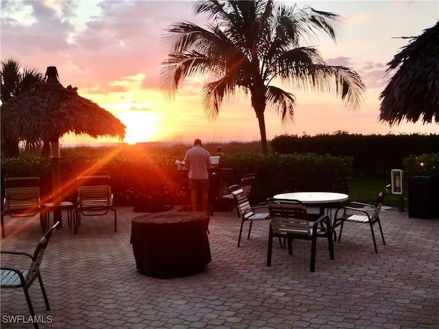 view of patio / terrace featuring outdoor dining space and a fire pit