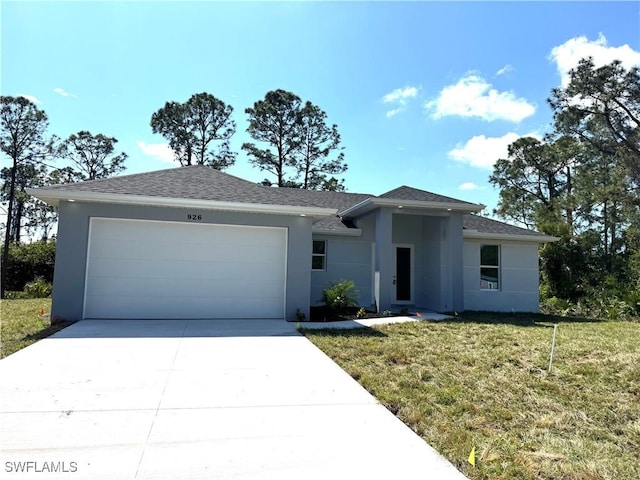 view of front of property with stucco siding, a front lawn, concrete driveway, and an attached garage