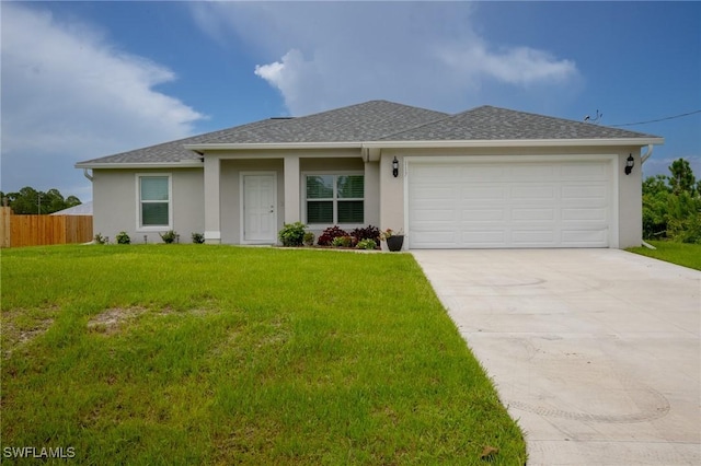 ranch-style house featuring a front lawn, fence, stucco siding, a garage, and driveway