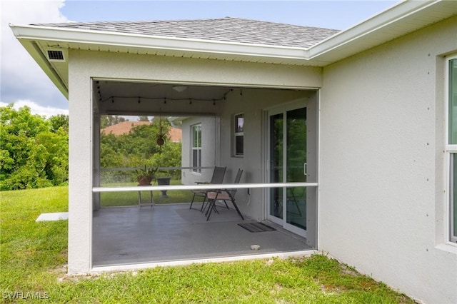 view of patio with visible vents and a sunroom