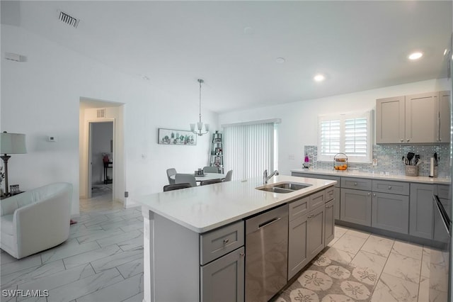 kitchen featuring visible vents, gray cabinetry, dishwasher, marble finish floor, and a sink