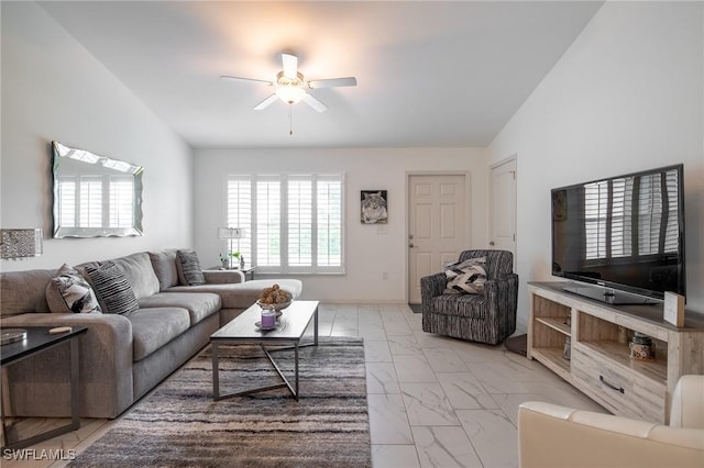 living room with marble finish floor, ceiling fan, and vaulted ceiling