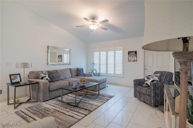 living room featuring marble finish floor, ceiling fan, and vaulted ceiling